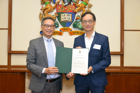 Dr. Ngai Tseung Cheung (right) receiving a Certificate of Appreciation from Ir. Ricky Lau, JP (left)